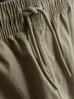 7-15 años | Pantalones cargo con bajos ajustados