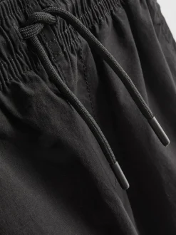 7-15 años | Pantalones cargo con bajos ajustados