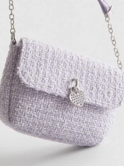 Bandolera de bouclé con colgante de corazón