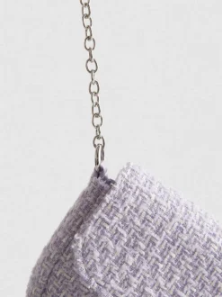 Bandolera de bouclé con colgante de corazón