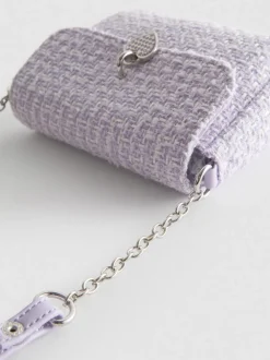 Bandolera de bouclé con colgante de corazón