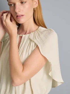 Blusa drapeada corta con efecto capa