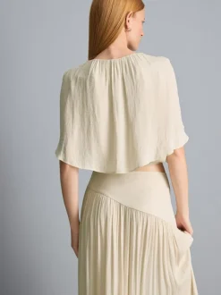 Blusa drapeada corta con efecto capa