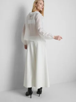 Blusa transparente con volantes
