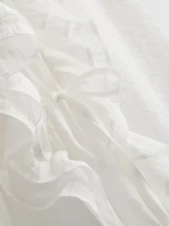 Blusa transparente con volantes