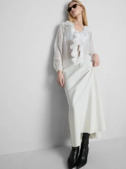 Blusa transparente con volantes