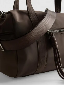 Bolso cilíndrico con bolsillo y cremallera