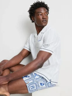 Camisa de cuello con solapas y bordado de peces