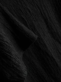 Camiseta asimétrica con textura