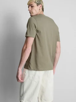 Camiseta con gráficos de palmeras