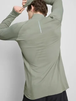 Camiseta deportiva con cremallera de 1/4
