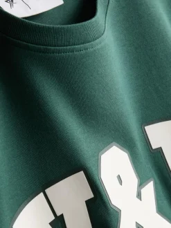 Camiseta deportiva holgada con estampado gráfico