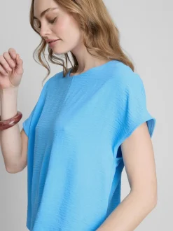 Camiseta relajada y fluida con cuello redondo