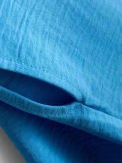 Camiseta relajada y fluida con cuello redondo