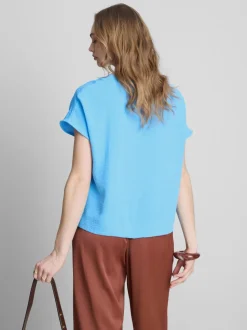 Camiseta relajada y fluida con cuello redondo