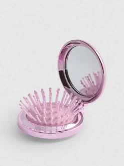 Minicepillo compacto plegable para el cabello