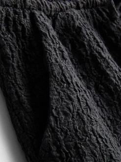 Pantalón corto fruncido con cordón de ajuste