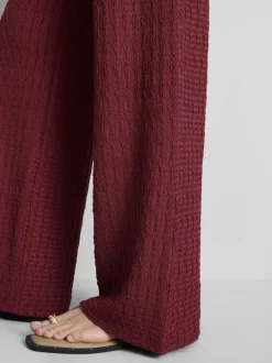 Pantalones anchos con efecto fruncido