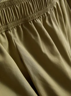 Pantalones bombachos con pinzas de tacto suave