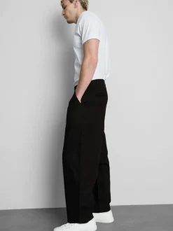 Pantalones chinos holgados de tiro medio