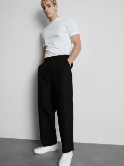 Pantalones chinos holgados de tiro medio