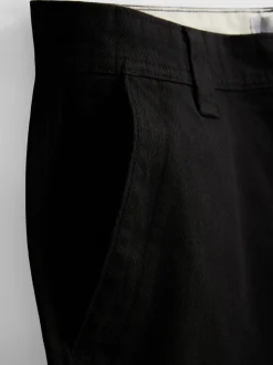 Pantalones chinos holgados de tiro medio