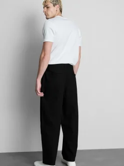 Pantalones chinos holgados de tiro medio
