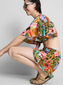 Pantalones cortos con volantes y estampado tropical