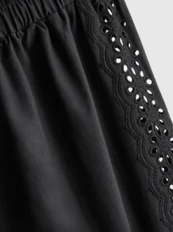 Pantalones de algodón anchos con detalle bordado