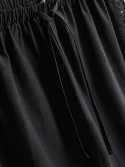 Pantalones de algodón anchos con detalle bordado