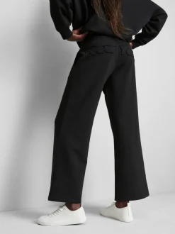 Pantalones de chándal anchos con aplicación