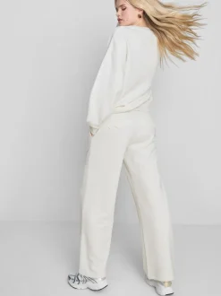 Pantalones de chándal anchos con aplicación