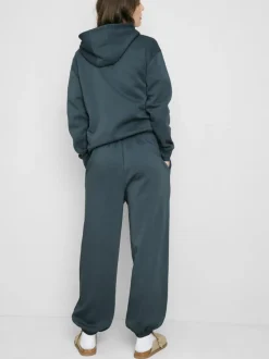 Pantalones de chándal con bajos ajustados en mezcla de algodón