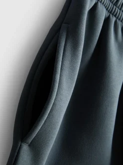 Pantalones de chándal con bajos ajustados en mezcla de algodón