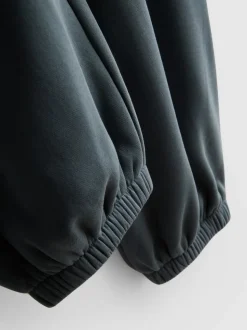 Pantalones de chándal con bajos ajustados en mezcla de algodón