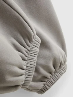 Pantalones de chándal con bajos ajustados en mezcla de algodón
