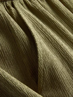 Pantalones de pernera ancha con efecto arrugado