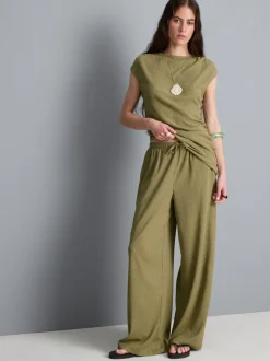 Pantalones de pernera ancha con efecto arrugado