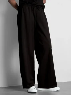 Pantalones de pernera ancha con textura