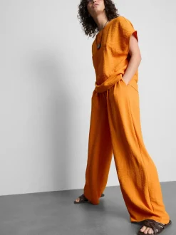 Pantalones de pernera ancha con cintura elástica
