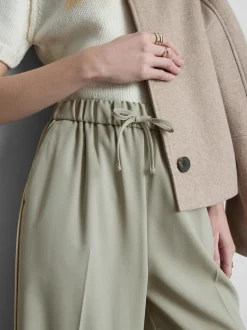 Pantalones de pernera ancha con rayas laterales