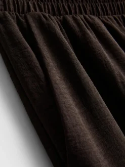 Pantalones de pernera ancha con cintura elástica