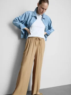 Pantalones de pernera ancha con efecto arrugado