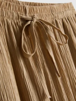 Pantalones de pernera ancha con efecto arrugado