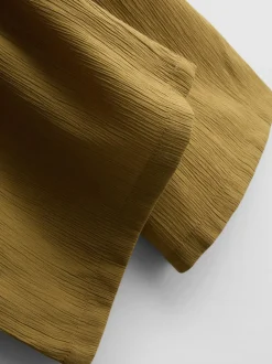 Pantalones de pernera ancha con efecto arrugado