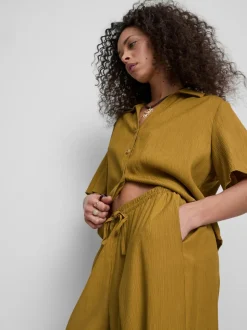 Pantalones de pernera ancha con efecto arrugado