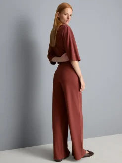 Pantalones de punto plisados de pernera ancha