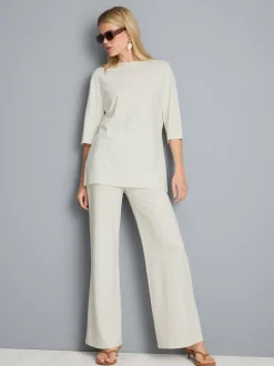 Pantalones de punto plisados de pernera ancha