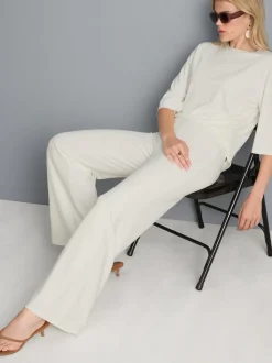 Pantalones de punto plisados de pernera ancha