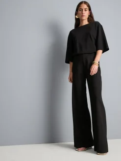 Pantalones de punto plisados de pernera ancha